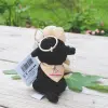 Porte clef avec une petite peluche noir en forme de chien avec un dossard "Chiens Guides de Paris"