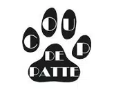 logo de l'association coup de patte qui est représenté par une patte de chien en noir avec le nom de l'association inscrite dessus en blanc