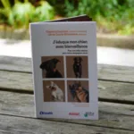 Photo de la couverture du livre. Sur la couverture, quatre encadrés présentent des photos de chiens.